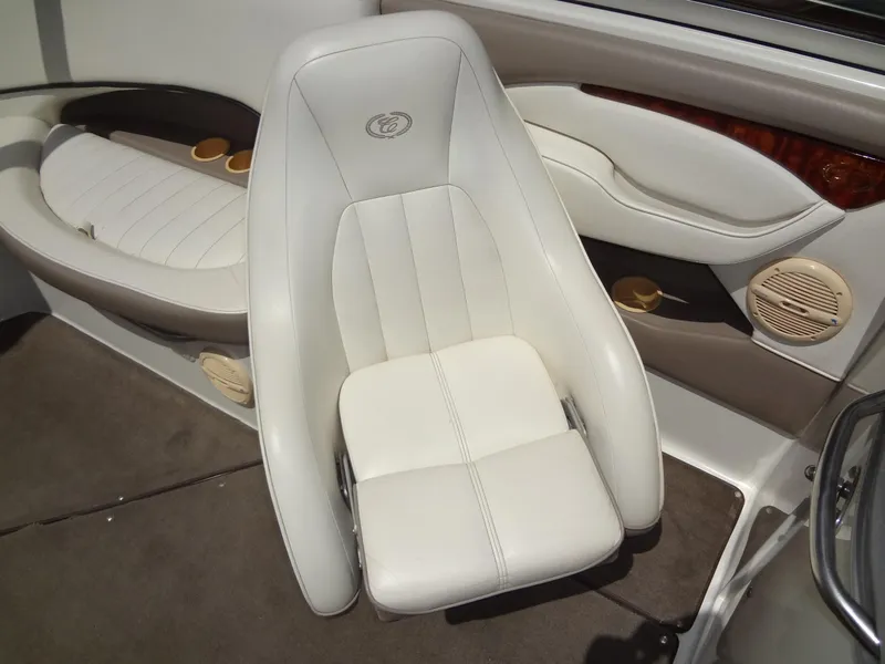 Slide: The Image of White leather seat in a 2004 Cobalt 240 boat interior. - 21