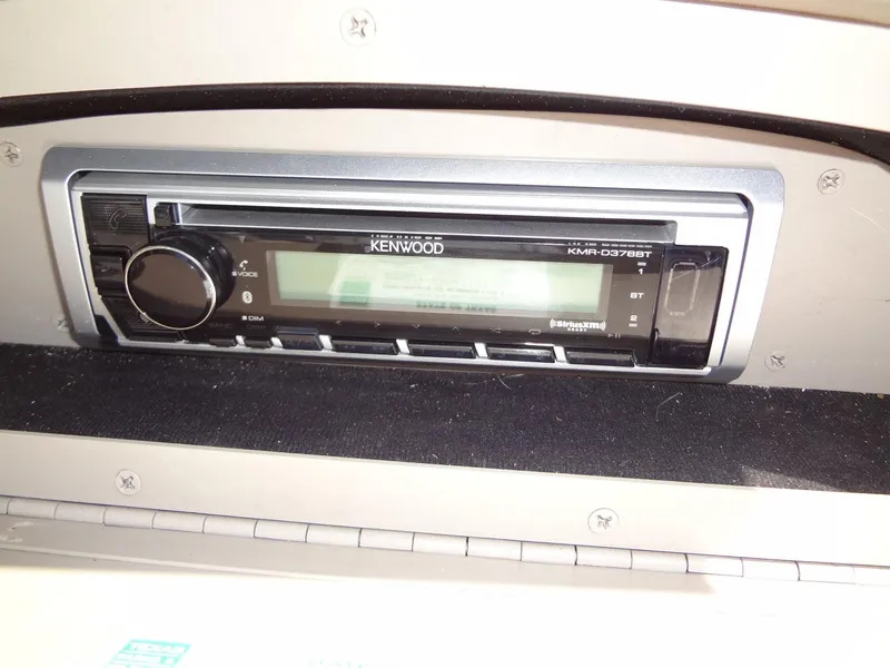 Slide: The Image of Kenwood stereo system in a 2004 Cobalt 240 boat dashboard. - 31