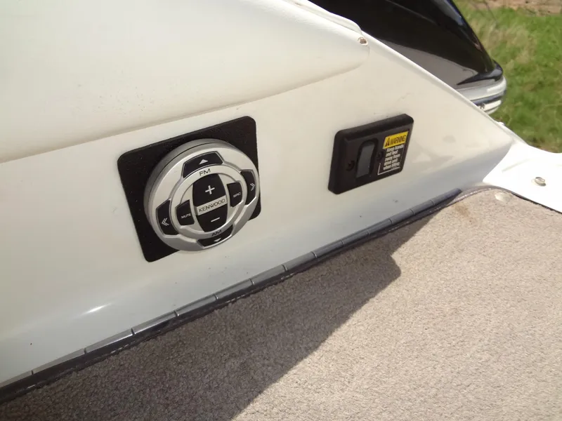 Slide: The Image of Control panel on a 2004 Cobalt 240 boat, featuring audio and warning systems. - 32