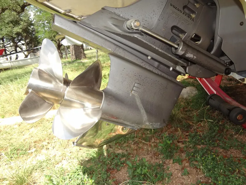 Slide: The Image of Close-up of a 2004 Cobalt 240 boat propeller on grass. - 37