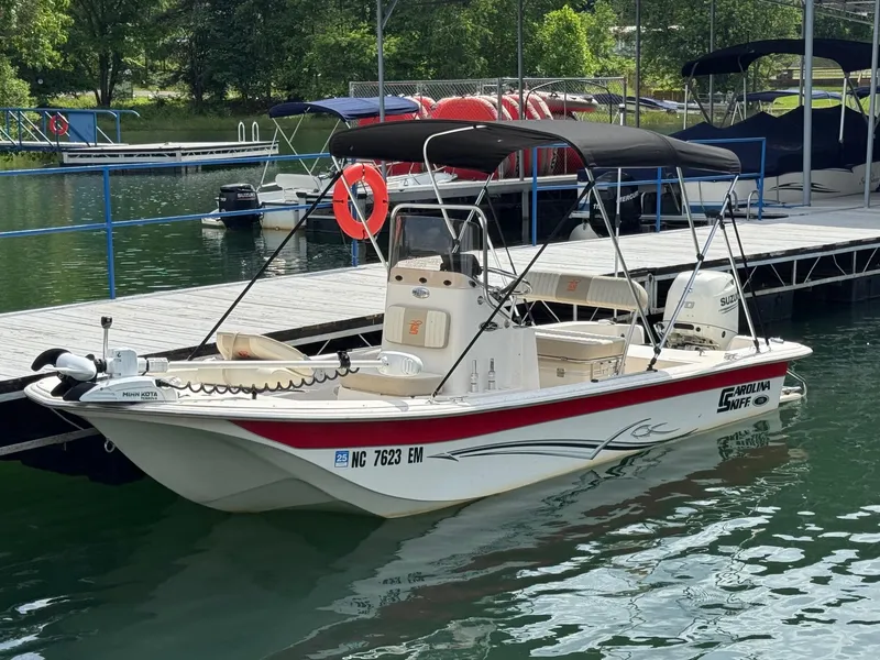 The Image of 2019 Carolina Skiff 18 JVX CC boat docked on a sunny day. - 0