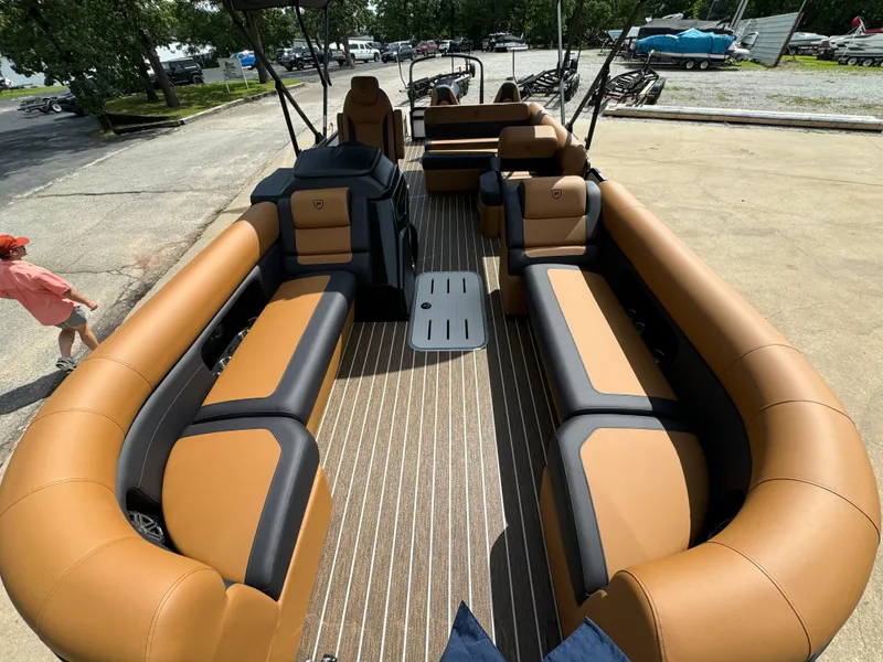 Slide: The Image of 2025 Premier 250 Sunsation Rear Social pontoon boat with spacious seating and modern design. - 14