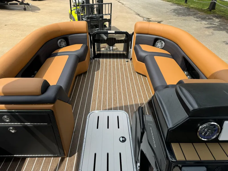 Slide: The Image of 2025 Premier 250 Sunsation Rear Social pontoon boat with stylish seating and modern design. - 21