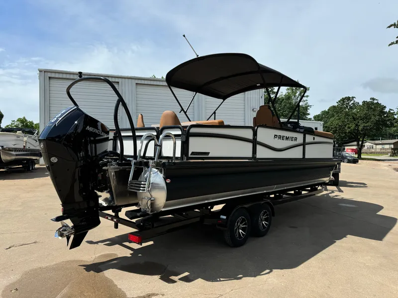 Slide: The Image of 2025 Premier 250 Sunsation Rear Social pontoon boat with canopy and Mercury outboard motor. - 7