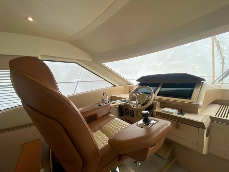 Slide: The Image of Interior helm of 2017 Beneteau Monte Carlo MC6 yacht, featuring luxurious leather seating and modern controls. - 30