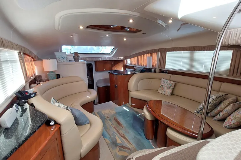 Slide: The Image of Luxurious interior of 2004 Sea Ray 390 Motor Yacht with elegant seating and decor. - 11