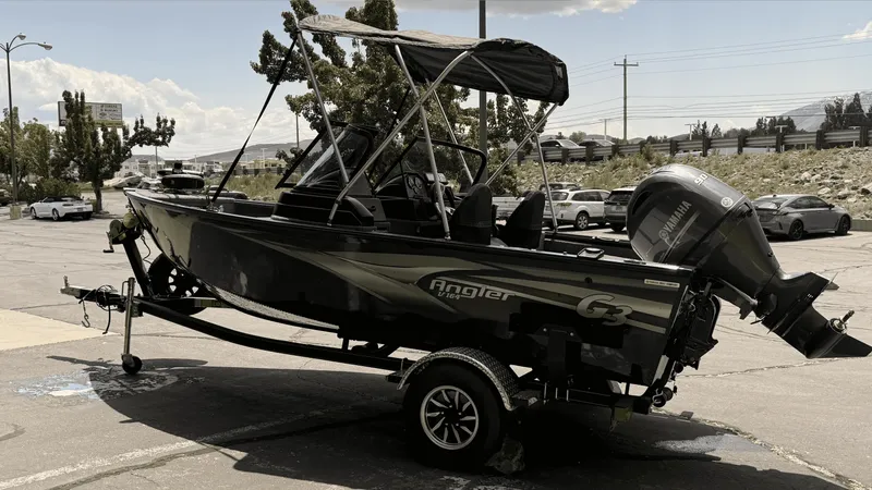 Slide: The Image of 2024 G3 Angler V164 F boat on trailer in parking lot. - 1