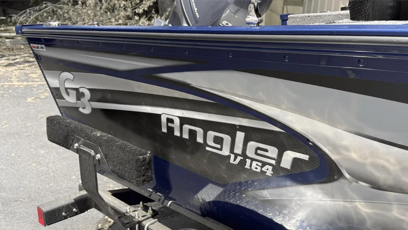 Slide: The Image of 2024 G3 Angler V164 F boat side view with logo and design details. - 2