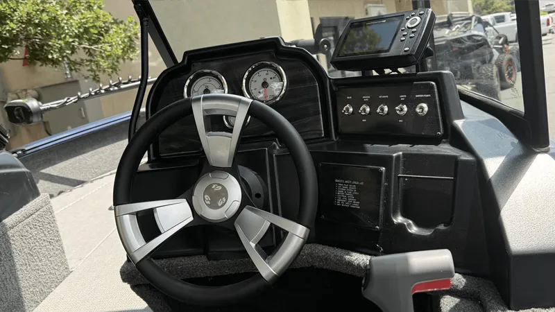 Slide: The Image of 2024 G3 Angler V164 F boat dashboard with steering wheel and control panel. - 3