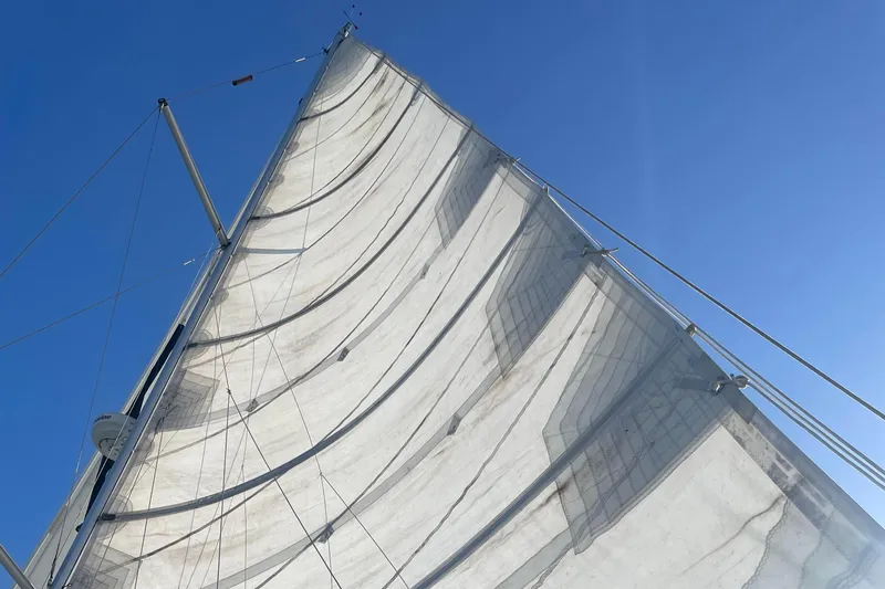 Slide: The Image of Sail of 2010 Hunter 49 Aft Cockpit against clear blue sky. - 26