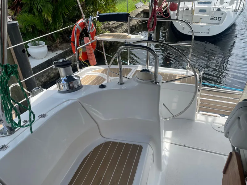 Slide: The Image of 2010 Hunter 49 Aft Cockpit sailboat with steering wheel and deck view. - 31