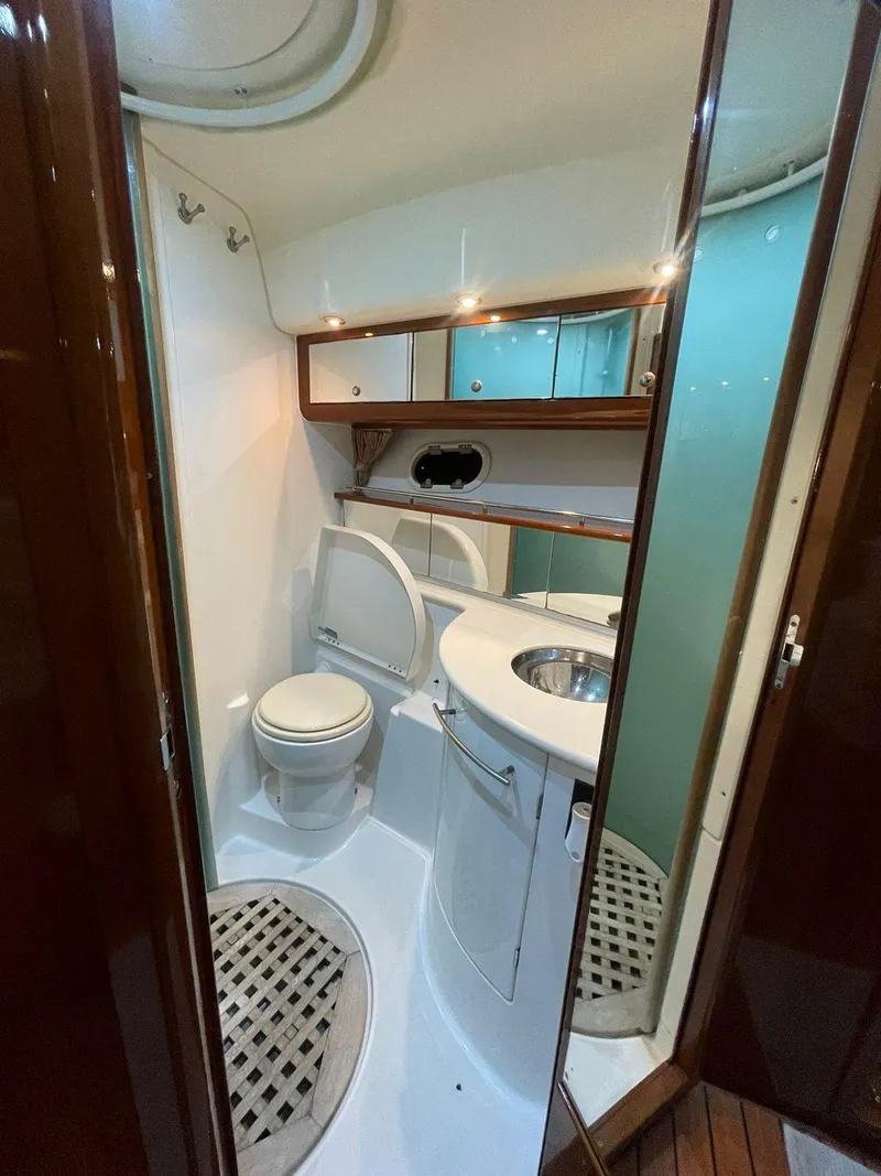 Slide: The Image of 2006 Prestige 46 yacht bathroom with modern fixtures and wooden accents. - 10