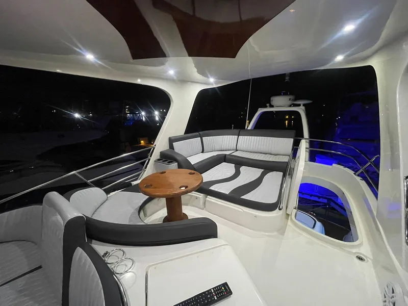Slide: The Image of Luxurious 2006 Prestige 46 yacht interior with elegant seating and ambient lighting. - 11