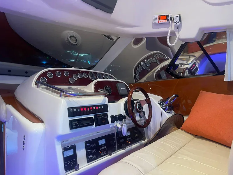 Slide: The Image of Interior of a 2006 Prestige 46 yacht cockpit with control panel and seating. - 5