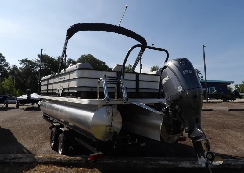 Slide: The Image of 2025 Veranda VISTA SPORT 22 pontoon boat with Yamaha 150 engine, parked outdoors. - 10