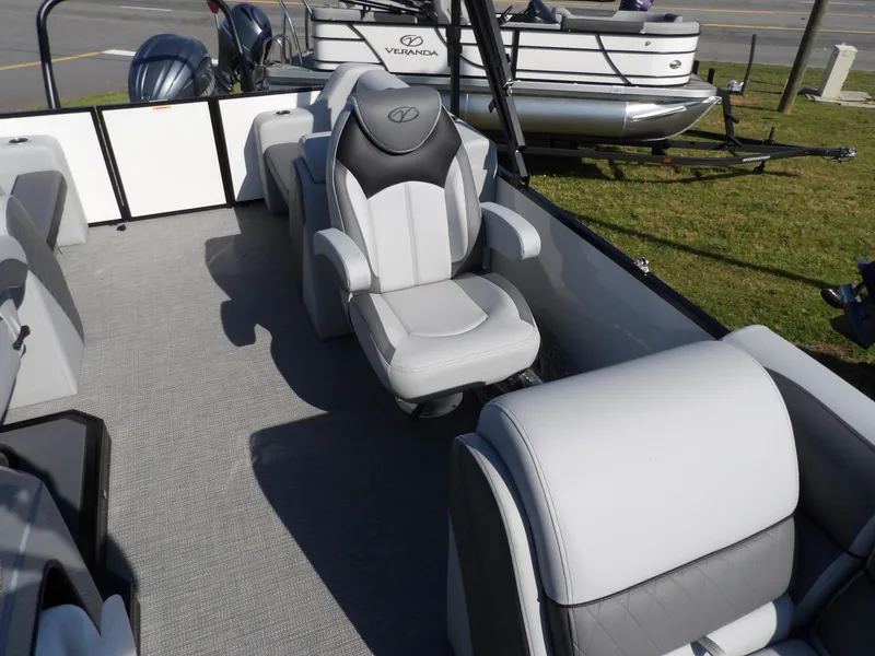 Slide: The Image of 2025 Veranda VISTA SPORT 22 pontoon boat interior with gray seating and modern design. - 13