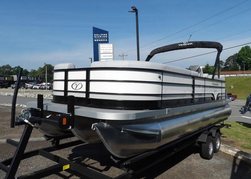 Slide: The Image of 2025 Veranda VISTA SPORT 22 pontoon boat on trailer at dealership. - 3