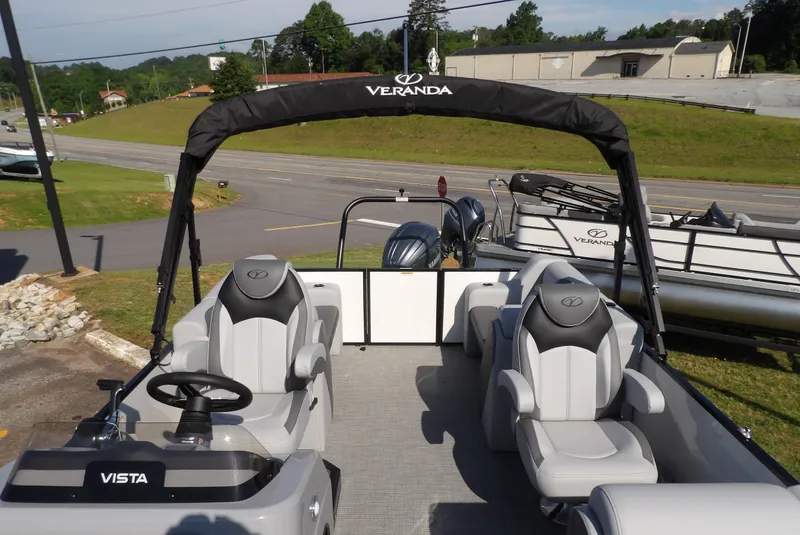 Slide: The Image of 2025 Veranda VISTA SPORT 22 pontoon boat with sleek seating and dual engines. - 6