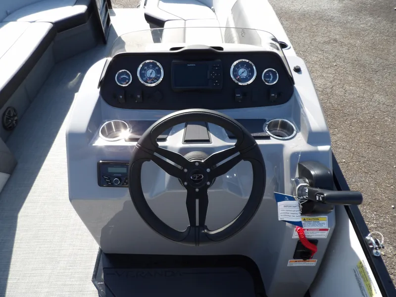 Slide: The Image of 2025 Veranda VISTA SPORT 22 boat dashboard with steering wheel and gauges. - 8