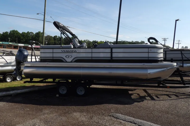 Slide: The Image of 2025 Veranda VISTA SPORT 22 pontoon boat on trailer, side view. - 9