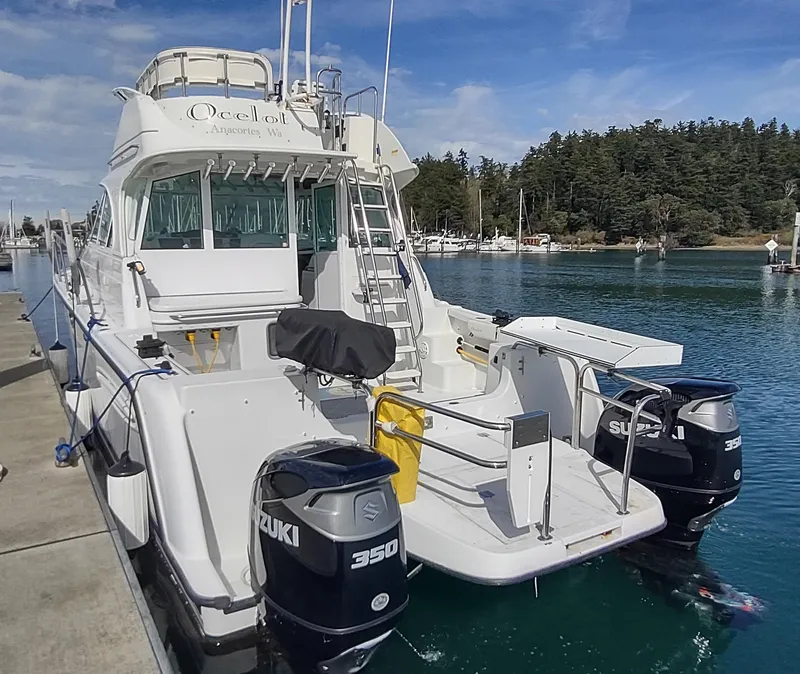 Slide: The Image of 2005 Glacier Bay 3490 Ocean Runner boat docked with twin Suzuki 350 engines. - 33