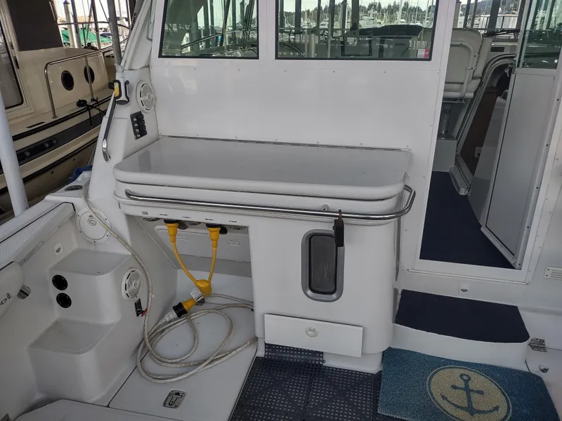 Slide: The Image of 2005 Glacier Bay 3490 Ocean Runner boat interior with utility area and storage. - 36