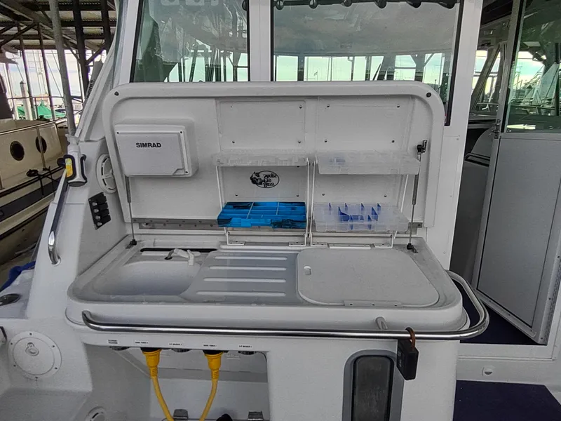 Slide: The Image of 2005 Glacier Bay 3490 Ocean Runner boat interior with fishing station and storage compartments. - 37