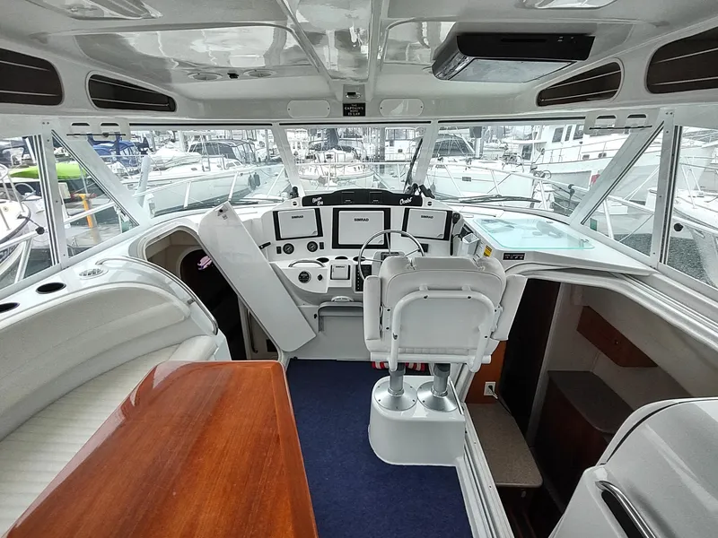 Slide: The Image of 2005 Glacier Bay 3490 Ocean Runner boat interior with helm, seating, and navigation equipment. - 39