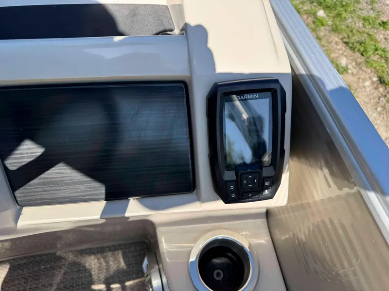 Slide: The Image of Dashboard of 2018 Bennington SX 22 SSBXP with Garmin device and cup holder. - 21
