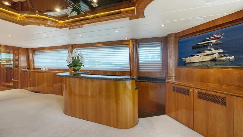Slide: The Image of Luxurious interior of 2007 Horizon 95 yacht with elegant wood finishes and modern decor. - 12