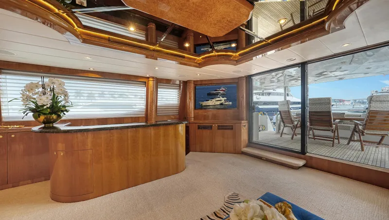 Slide: The Image of Luxurious interior of 2007 Horizon 95 yacht with elegant wood finishes and large windows. - 15