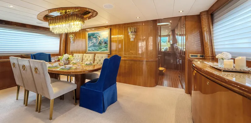 Slide: The Image of Luxurious dining area on 2007 Horizon 95 yacht with elegant decor and chandelier. - 16