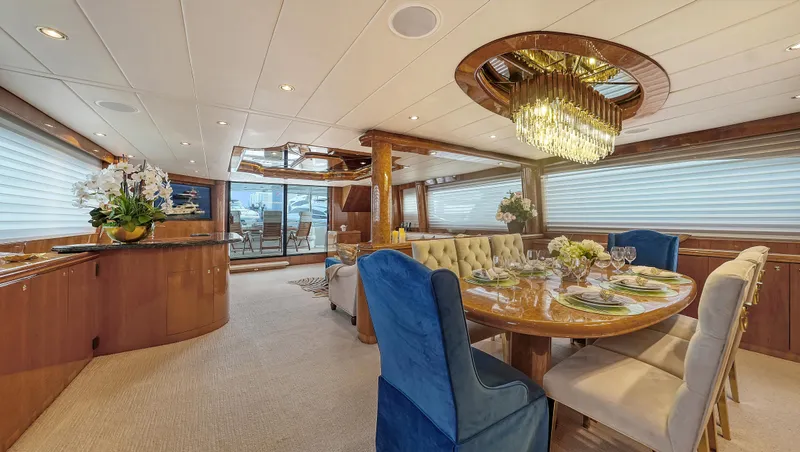 Slide: The Image of Luxurious interior of 2007 Horizon 95 yacht with elegant dining area and chandelier. - 18