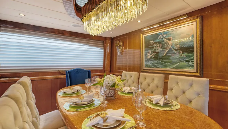 Slide: The Image of Luxurious dining area on 2007 Horizon 95 yacht with elegant decor and chandelier. - 19