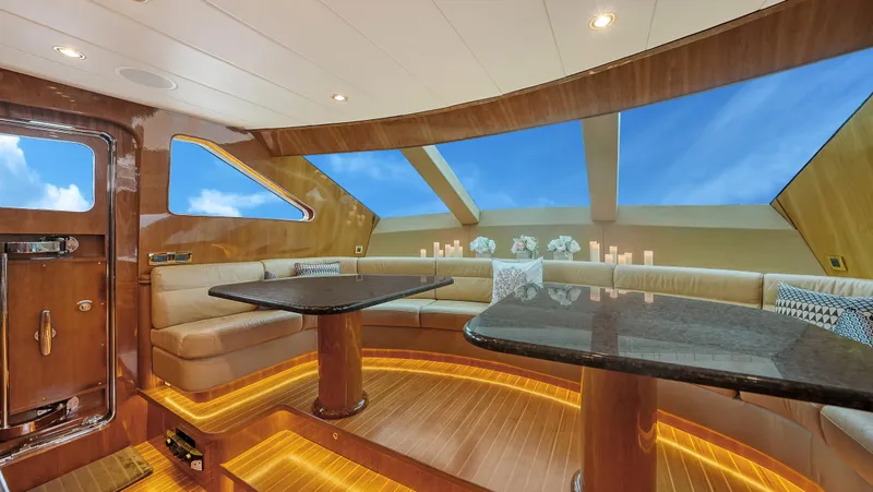 Slide: The Image of Luxurious interior of 2007 Horizon 95 yacht with panoramic windows and elegant seating. - 21