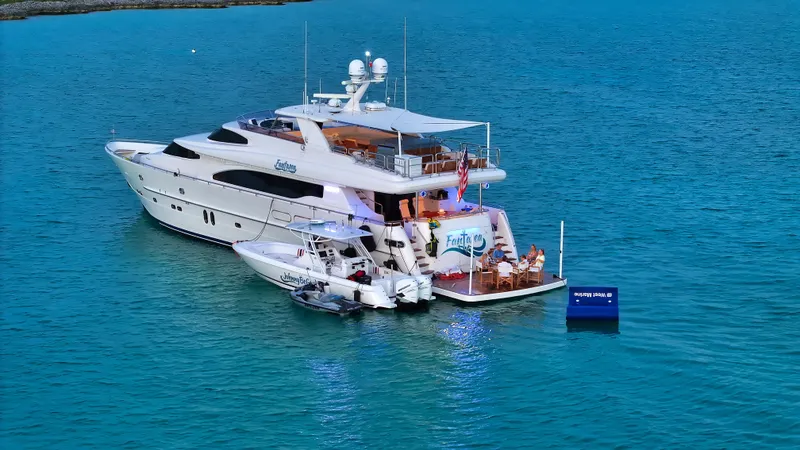Slide: The Image of Luxurious 2007 Horizon 95 yacht anchored in serene blue waters. - 3