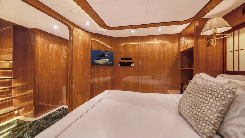 Slide: The Image of Luxurious cabin interior of 2007 Horizon 95 yacht with wood paneling and modern amenities. - 37