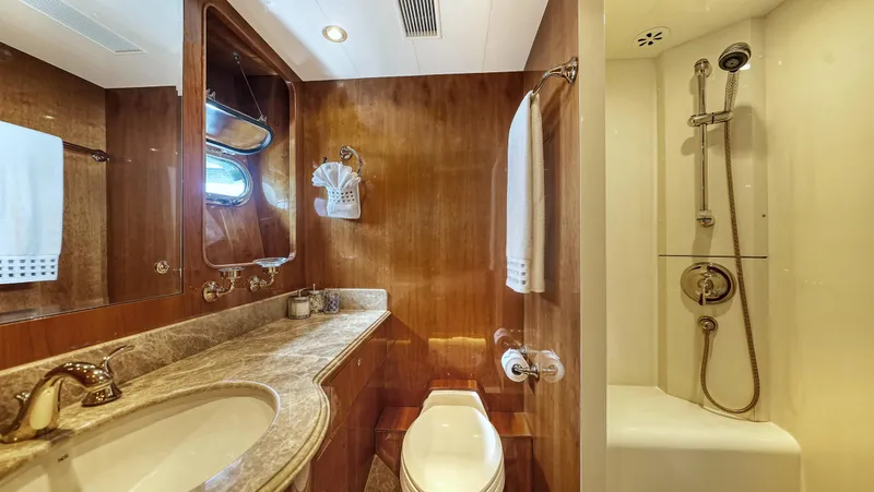 Slide: The Image of Luxurious bathroom in 2007 Horizon 95 yacht with wood accents and modern fixtures. - 38