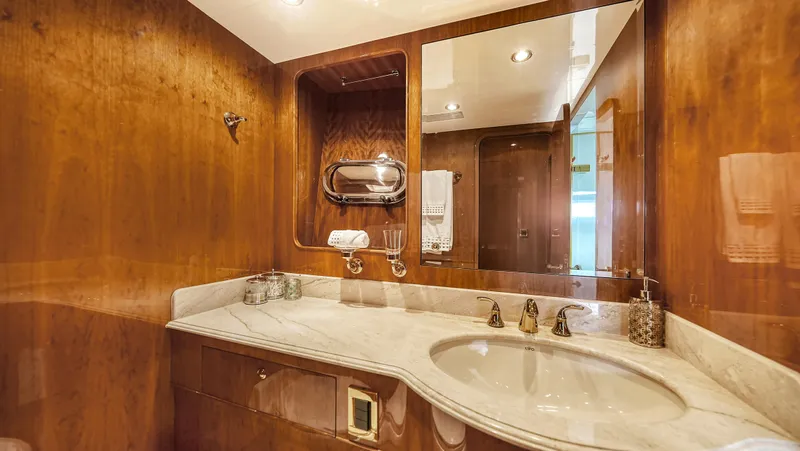 Slide: The Image of Luxurious bathroom in 2007 Horizon 95 yacht with wooden accents and marble countertop. - 40