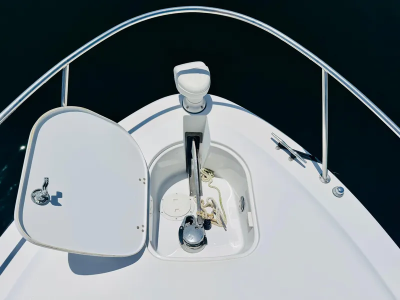Slide: The Image of Bow of 2000 Chris-Craft 308 Express Cruiser with anchor compartment open. - 24