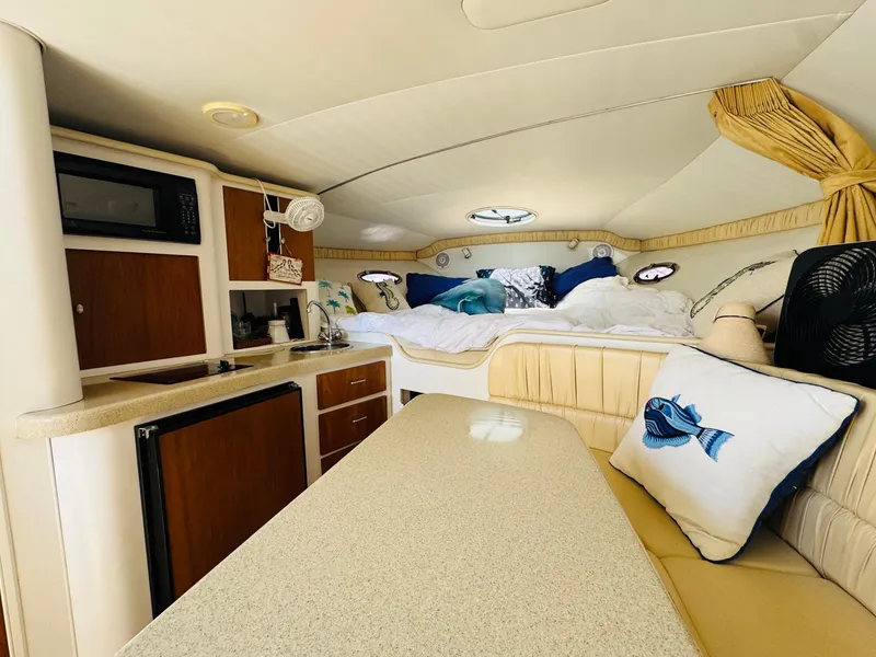 Slide: The Image of Interior of 2000 Chris-Craft 308 Express Cruiser with cozy cabin and kitchenette. - 28