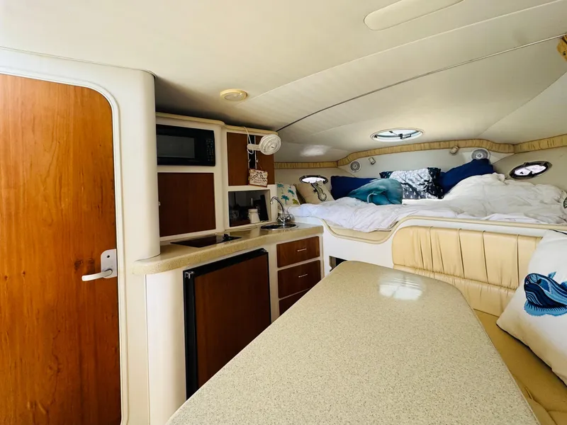 Slide: The Image of Interior of 2000 Chris-Craft 308 Express Cruiser with kitchenette and cozy sleeping area. - 29