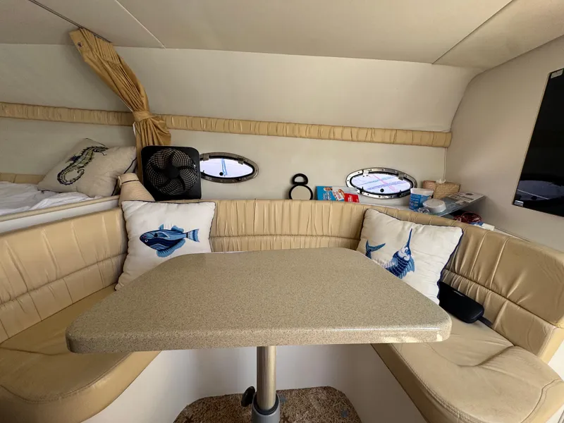 Slide: The Image of Interior of 2000 Chris-Craft 308 Express Cruiser with cozy seating and nautical decor. - 31