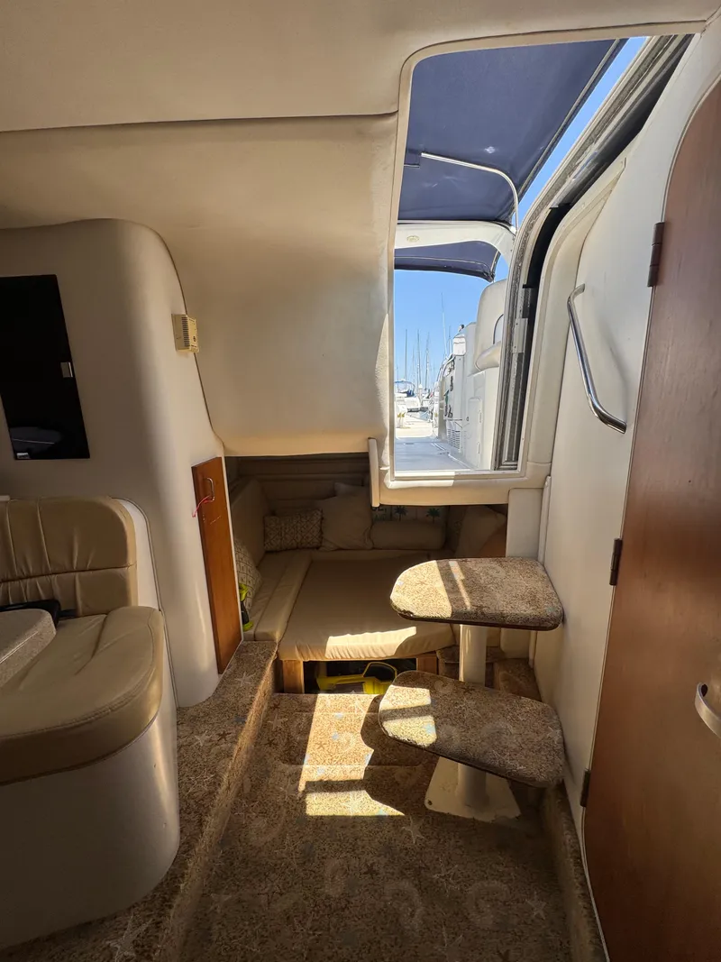 Slide: The Image of Interior of 2000 Chris-Craft 308 Express Cruiser with seating and steps, under natural light. - 33
