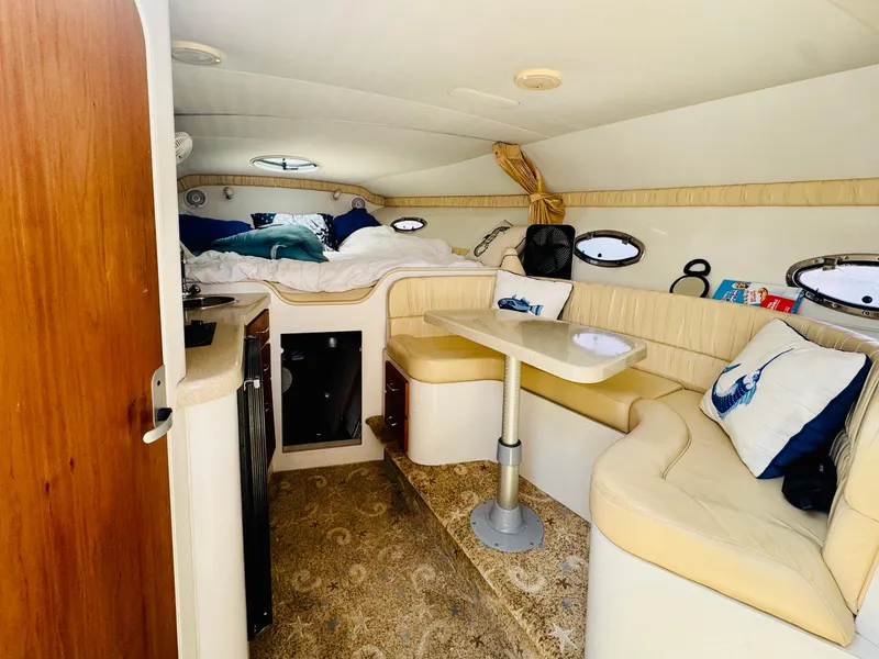 Slide: The Image of Interior of 2000 Chris-Craft 308 Express Cruiser with cozy seating and sleeping area. - 35