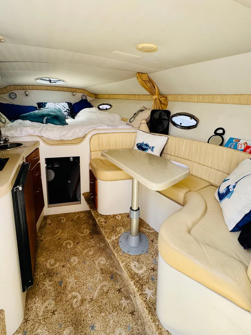 Slide: The Image of Interior of 2000 Chris-Craft 308 Express Cruiser with cozy seating and sleeping area. - 37