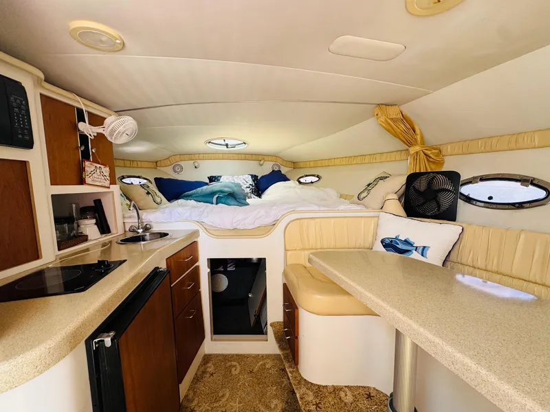 Slide: The Image of Interior of 2000 Chris-Craft 308 Express Cruiser with cozy cabin and kitchenette. - 40