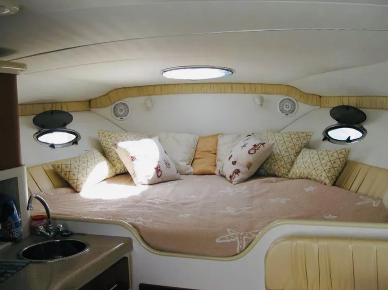 Slide: The Image of 2000 Chris-Craft 308 Express Cruiser interior with cozy bed and pillows. - 44