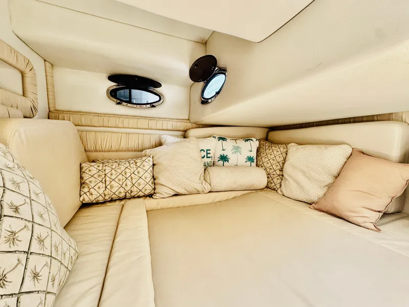 Slide: The Image of 2000 Chris-Craft 308 Express Cruiser cabin with cozy bedding and decorative pillows. - 46