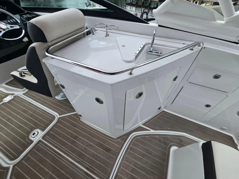 Slide: The Image of 2023 Monterey M-65 boat interior with sleek white cabinetry and modern design. - 11